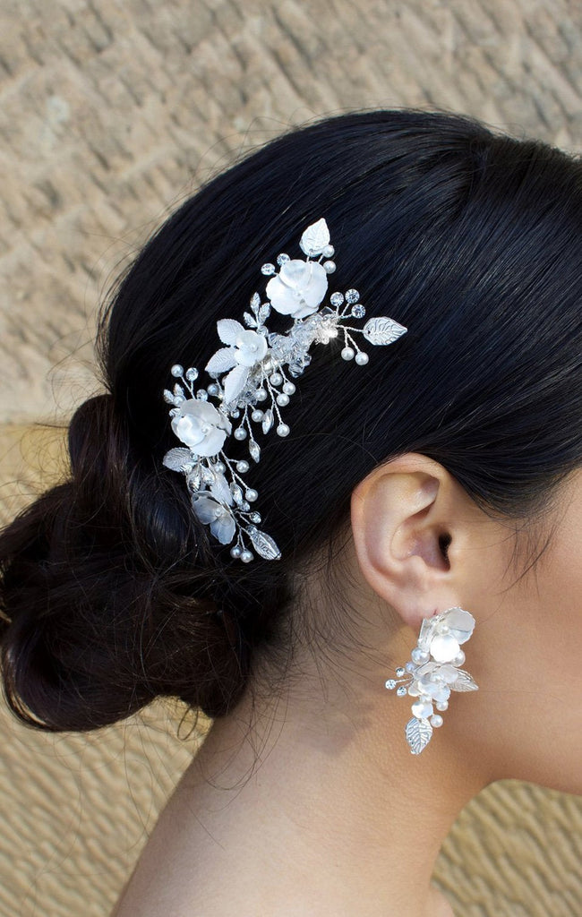 Silver and pearl hair comb with clip fitting with matching earring on dark hair