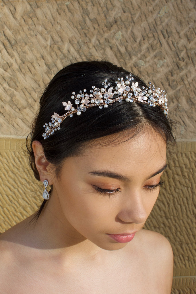 Low Pale Rose Gold Tiara with pearls made with five points worn by a dark hair bride