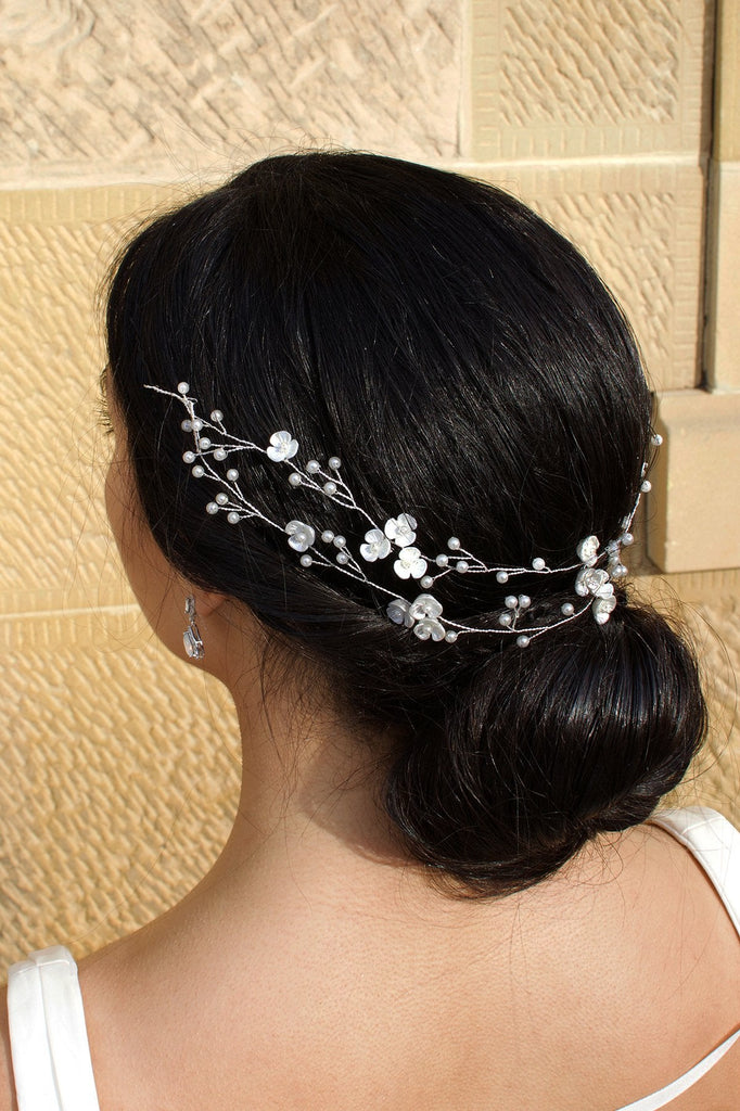 Double row silver and pearl vine on a dark haired model with a stone wall backdrop