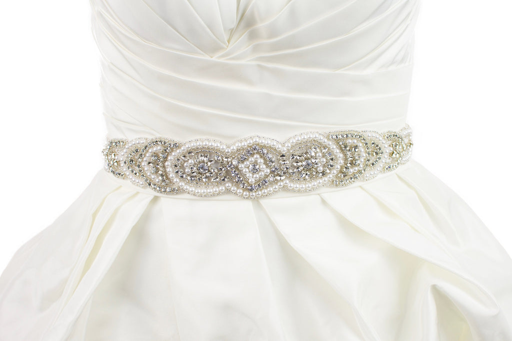 Pearl Bridal Belt Abigail shown on ivory satin ribbon on a plain bridal gown.