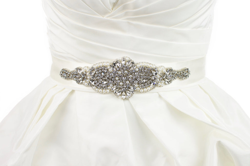 A short wide bridal belt worn on a bridal dress