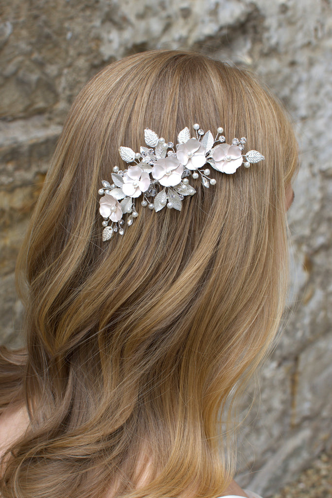 Pale Pink flower side comb worn by a blonde model bride