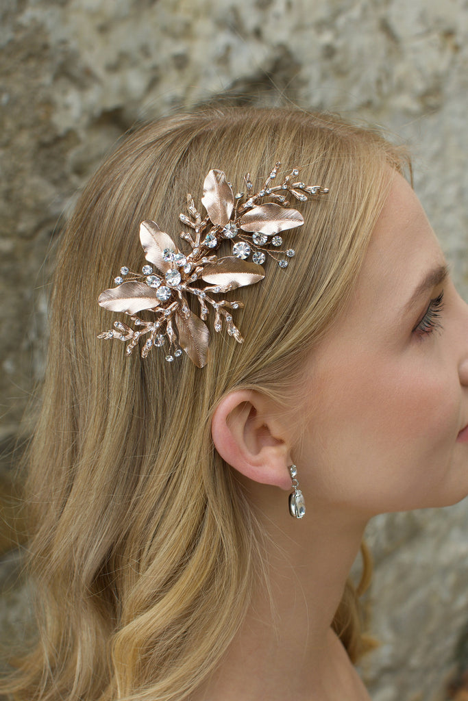 Rose gold leaves and twigs bridal side comb worn by a blonde model