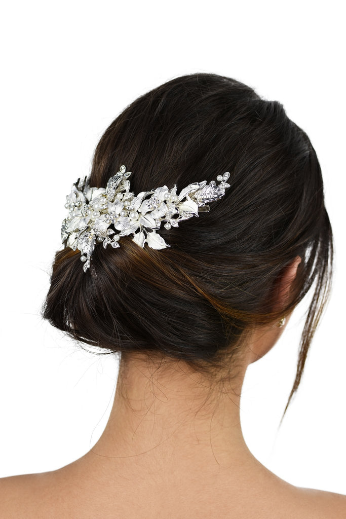 Short Wide Silver Vine with leaves and pearls worn at the back of a models head with a white background
