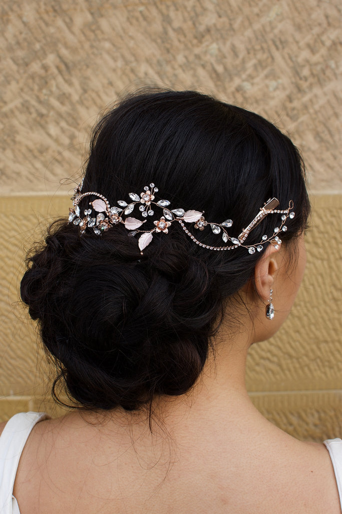 Rose Gold Bridal Vine with leaves and Flowers in the hair of a model with a stone wall backdrop